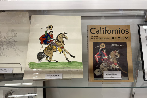 Jo Mora display with his artwork showing a man on a horse