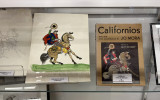 Jo Mora display with his artwork showing a man on a horse