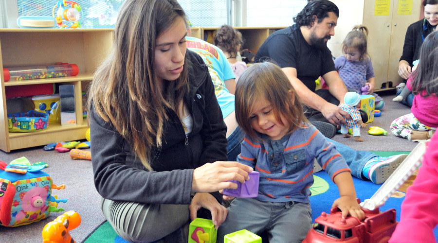 Parents and children playing with toys during Playgroup.