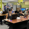 Adult students working on computers in the Literacy Center