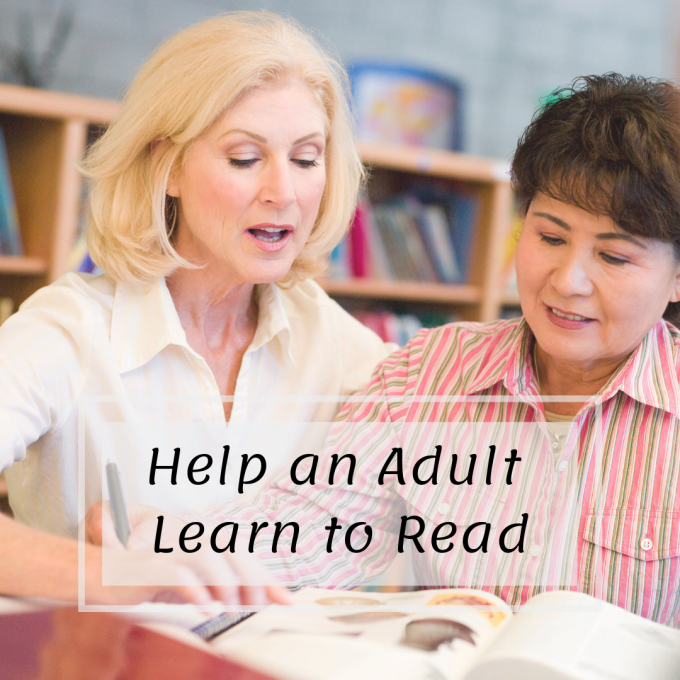 Two adult women are looking over a book. Text: Help an adult learn to read.