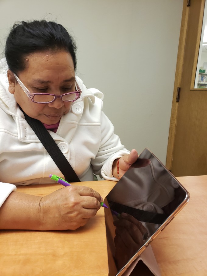 Photo of citizenship student using iPad