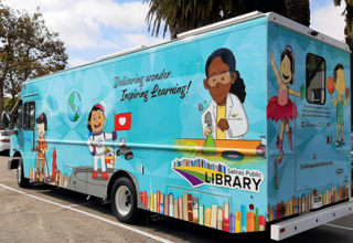 Bookmobile with cartoon images of kids engaging in learning activities
