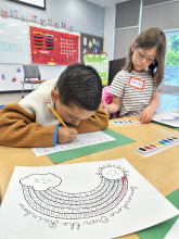 Two children are doing activities at Kinder Boot Camp.